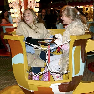 Children on a fairground ride, 2005
