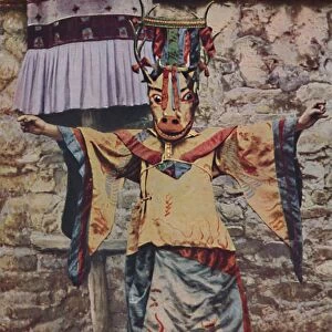 Tibetan lama attired for the devil dance, c1935