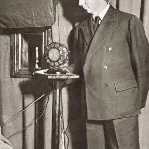 John Logie Baird, 1888 - 1946. Scottish Engineer And Inventor Of The Worlds First Practical, Publicly Demonstrated Television System. Seen Here Watching The First Televised Play In 1930. From The Story Of 25 Eventful Years In Pictures, Published 1935