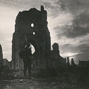 Stereoview, World War One, The Great War, Realistic Travels military photographs circa 1918. Guarding sacred Ypres, where British herosim shone resplendent through the wars darkest hours. Soldier standing in ruined cathedral