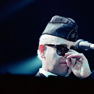 Elton John performing in concert in Paris during his Reg Strikes Back Tour