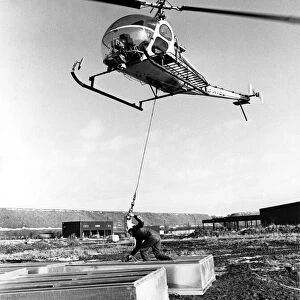 A Hiller UH-12 helicopter was called into lift 48 smoke ventilators onto the roof of a