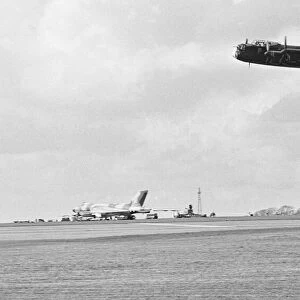 Old and new, a Avro Lancaster over flies a Avro Vulcan V bomber whilst taking part in