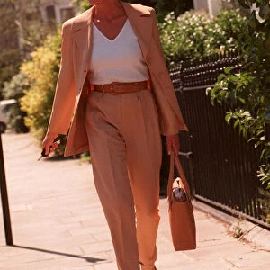 PRINCESS DIANA WEARING FAWN SUIT, WHITE TOP AND SUNGLASSES AND ALICE BAND AFTER HAVING