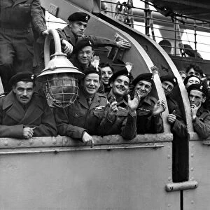 Returning from Korea Some of the troops lining the rails of the ship in mid-river