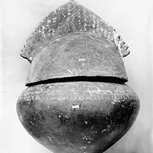 Bronze cinerary urn in the shape of a helmet, from the necropolis of the ancient Falerii Veteres, preserved in the Etruscan Museum of Villa Giulia, Rome
