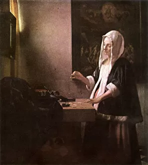 Woman Weighing Gold by Jan Vermeer